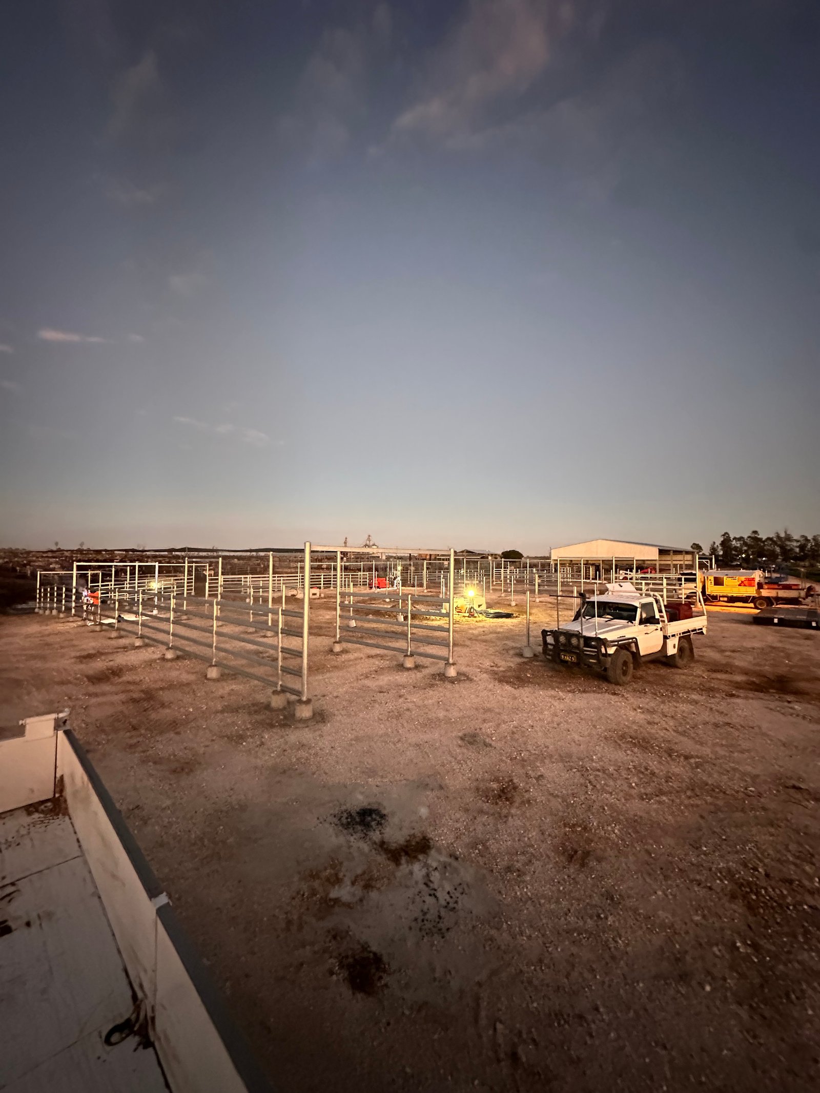 Team on-site at dusk — rural construction