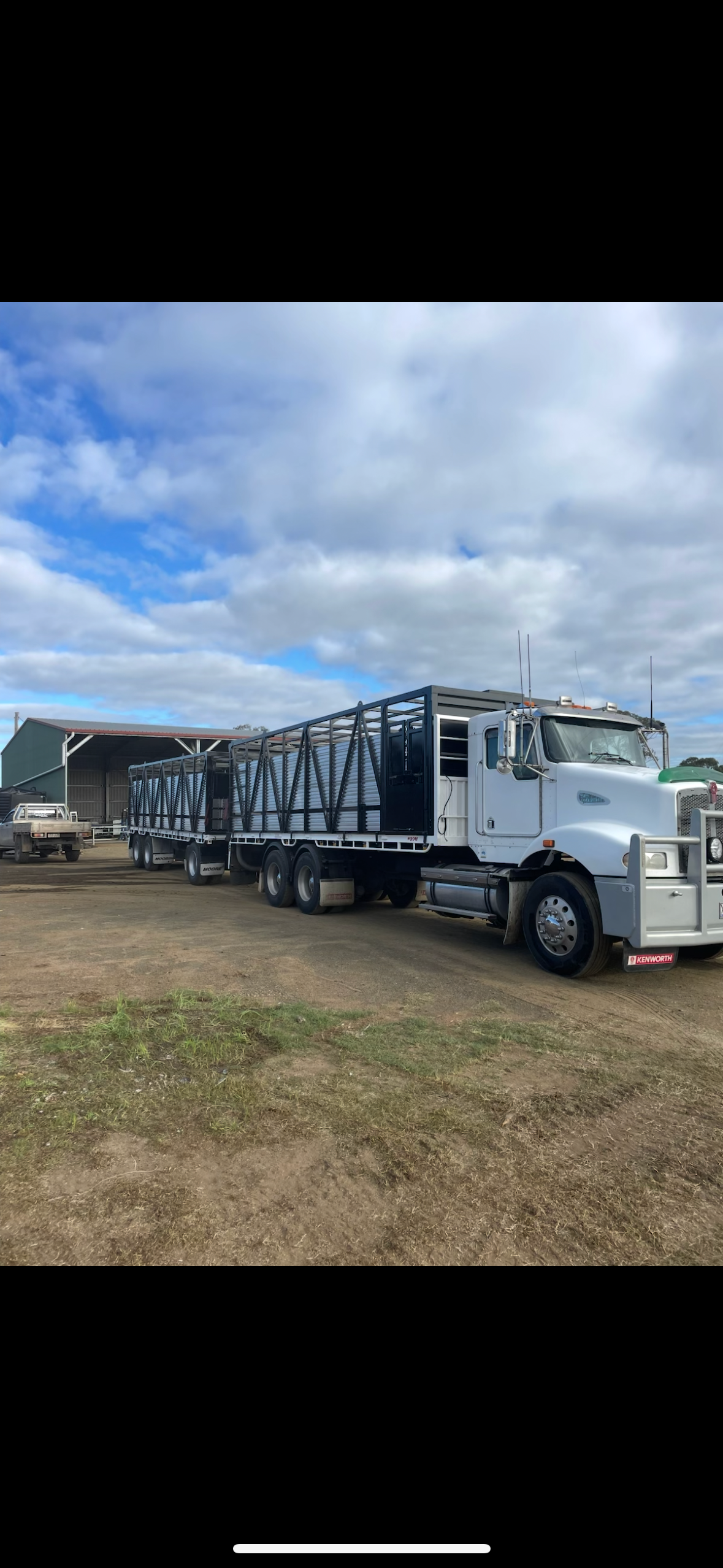 Kenworth semi with cattle cages — equipment transport